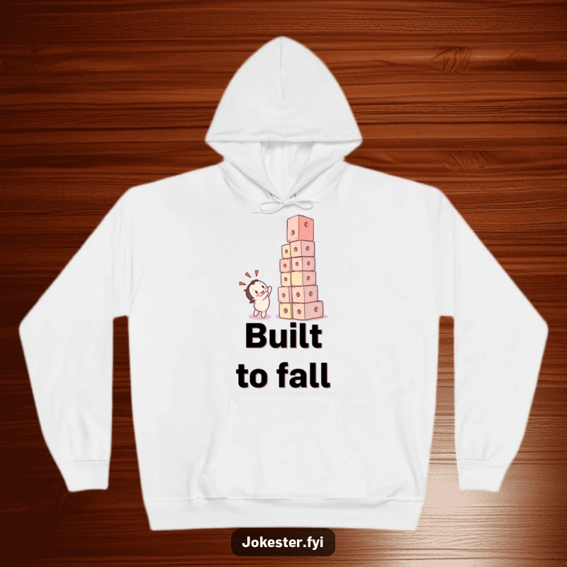 Funny hoodie showing a character joyfully watching a tower of colorful cubes tumble down in a comical heap. Cozy and amusing.