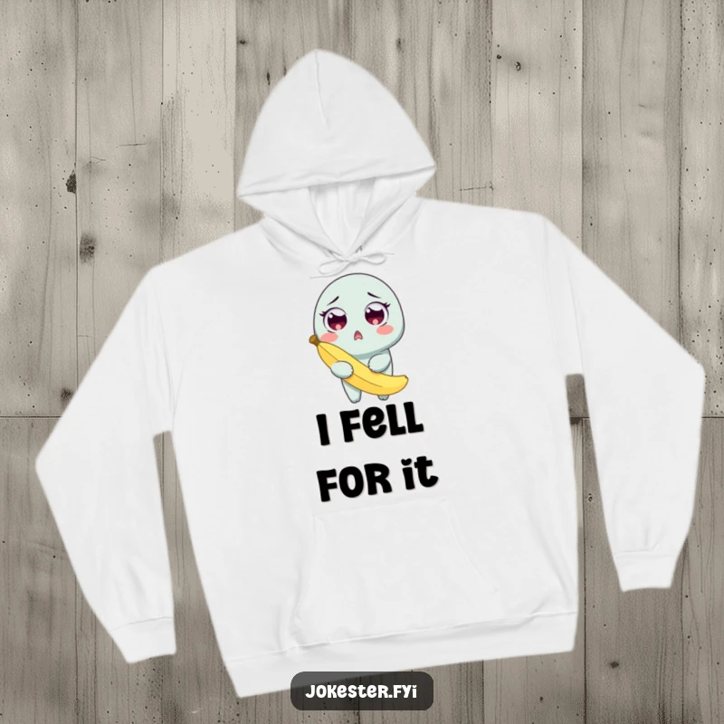 Funny hoodie showing a surprised character with wide eyes, clutching a banana peel after a comical slip.