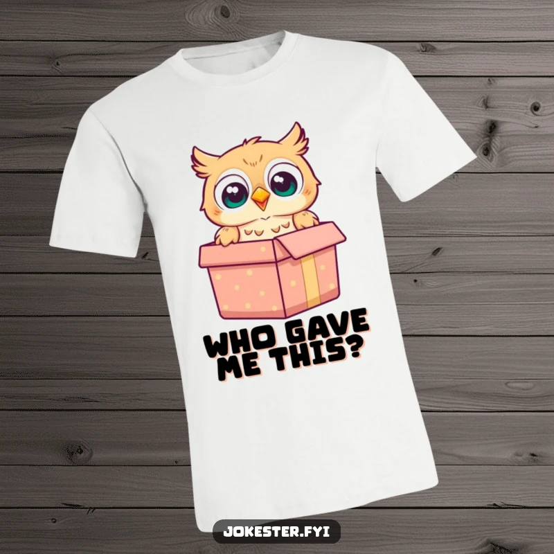 Funny owl t-shirt depicting a cheerful owl popping out of a gift box with a wide-eyed surprised look.